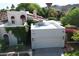 View of house with an attached garage, beautiful red awnings, and desert landscaping at 9430 S 47Th Pl, Phoenix, AZ 85044