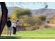 Resident enjoying an afternoon round of golf at our professionally maintained golf course at 9430 S 47Th Pl, Phoenix, AZ 85044