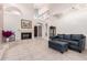 Spacious living room with tile flooring, fireplace, high ceilings, and comfortable seating at 9430 S 47Th Pl, Phoenix, AZ 85044