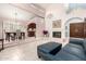 Inviting living room features tile floors, fireplace, access to dining area and lots of natural light at 9430 S 47Th Pl, Phoenix, AZ 85044
