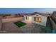 Paver patio and low maintenance backyard with artificial turf and exterior lighting at 11626 E Yeager Cyn, Gold Canyon, AZ 85118