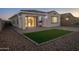 Spacious paver patio with artificial turf, low maintenance desert landscaping and outdoor lighting at 11626 E Yeager Cyn, Gold Canyon, AZ 85118