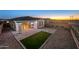 Spacious backyard featuring a covered patio, artificial turf, and modern hardscaping at 11626 E Yeager Cyn, Gold Canyon, AZ 85118