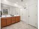 Modern bathroom with double vanity, large mirror, and glass-enclosed shower at 11626 E Yeager Cyn, Gold Canyon, AZ 85118