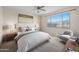 Cozy bedroom features a large window, a comfortable bed, and neutral décor at 11626 E Yeager Cyn, Gold Canyon, AZ 85118
