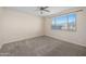 Bright bedroom features neutral walls, carpeted floors, and mountain views from the window at 11626 E Yeager Cyn, Gold Canyon, AZ 85118