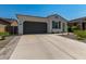Beautiful single story home with neutral color scheme, desert landscaping and an oversized driveway at 11626 E Yeager Cyn, Gold Canyon, AZ 85118