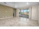 Bright living room features tile floors, sliding glass doors, and a ceiling fan for comfort at 11626 E Yeager Cyn, Gold Canyon, AZ 85118