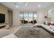 Bright living room showcasing a stylish white sectional and scenic backyard views through sliding glass doors at 11626 E Yeager Cyn, Gold Canyon, AZ 85118