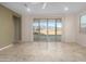 Open living space with bright light and doors leading to backyard patio at 11626 E Yeager Cyn, Gold Canyon, AZ 85118