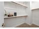 Bright walk-in closet features neutral carpet, shelving, and hanging rods at 11626 E Yeager Cyn, Gold Canyon, AZ 85118