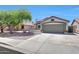 Inviting single-story home with a two-car garage and desert landscaping, perfect for curb appeal at 13443 W Post Dr, Surprise, AZ 85374