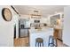 Bright kitchen with island, stainless steel appliances, bar seating and ample counter space at 13443 W Post Dr, Surprise, AZ 85374