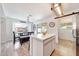 Open kitchen dining area with large windows and sliding glass doors to backyard at 13443 W Post Dr, Surprise, AZ 85374