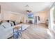 Stylish living room with wood-look floors, large sectional sofa and lots of natural light at 13443 W Post Dr, Surprise, AZ 85374