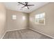 Spacious bedroom with carpet, ceiling fan, three windows providing natural light at 1367 S Country Club Dr # 1320, Mesa, AZ 85210