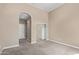 Neutral bedroom featuring an arched entrance to an ensuite and a mirrored sliding door closet at 1367 S Country Club Dr # 1320, Mesa, AZ 85210
