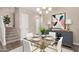 Elegant dining room featuring contemporary decor, a glass table, and sophisticated accents at 1367 S Country Club Dr # 1320, Mesa, AZ 85210