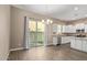 Open dining area with sliding glass doors to patio and kitchen with stainless appliances at 1367 S Country Club Dr # 1320, Mesa, AZ 85210