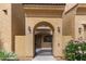 Charming front entrance with a decorative gate, beautiful flowerbeds, and well-kept landscaping at 1367 S Country Club Dr # 1320, Mesa, AZ 85210