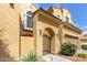 Inviting home exterior featuring a gated entry, lovely landscaping, and stylish architectural details at 1367 S Country Club Dr # 1320, Mesa, AZ 85210
