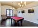 Game room features hardwood floors, pool table, and large decorative entry at 1367 S Country Club Dr # 1320, Mesa, AZ 85210