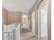 Bright hallway with carpet, multiple doorways and arched doorways to other rooms at 1367 S Country Club Dr # 1320, Mesa, AZ 85210