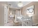 Well-lit hallway with stylish lighting, neutral decor, and a view of the upper level at 1367 S Country Club Dr # 1320, Mesa, AZ 85210