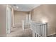 Second floor hallway with carpet, white railings, and multiple doorways leading to rooms at 1367 S Country Club Dr # 1320, Mesa, AZ 85210