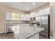 Modern kitchen with stainless steel appliances, granite countertops, and ample white cabinet space at 1367 S Country Club Dr # 1320, Mesa, AZ 85210