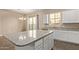 Modern kitchen featuring a large center island with granite countertops and stainless steel appliances at 1367 S Country Club Dr # 1320, Mesa, AZ 85210