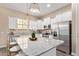 Modern kitchen with stainless steel appliances, granite countertops, and a stylish island at 1367 S Country Club Dr # 1320, Mesa, AZ 85210