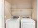 A laundry room with a shelf, and front loading washer and dryer at 1367 S Country Club Dr # 1320, Mesa, AZ 85210