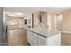 Open-concept kitchen and living space, perfect for entertaining, with a large island and fireplace at 1367 S Country Club Dr # 1320, Mesa, AZ 85210