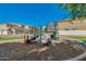 Well-maintained playground with slides and climbing equipment, surrounded by lush landscaping and homes at 1367 S Country Club Dr # 1320, Mesa, AZ 85210