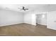 Bedroom featuring hardwood floors, a ceiling fan, and a large closet at 1526 E Glacier Pl, Chandler, AZ 85249