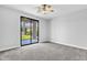 Bright bedroom with sliding glass doors leading to the backyard at 1526 E Glacier Pl, Chandler, AZ 85249