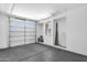 Spacious garage with a large window, epoxy floors, and plenty of room for storage and parking at 1526 E Glacier Pl, Chandler, AZ 85249