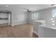 Spacious living area with hardwood floors, a ceiling fan, and view to kitchen at 1526 E Glacier Pl, Chandler, AZ 85249