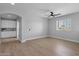 Bright open living space with hardwood floors, ceiling fan, and white cabinetry at 1526 E Glacier Pl, Chandler, AZ 85249