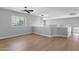Spacious room featuring hardwood floors, recessed lighting, and large windows at 1526 E Glacier Pl, Chandler, AZ 85249