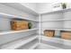 Organized walk-in pantry with lots of shelves and room for storage at 1526 E Glacier Pl, Chandler, AZ 85249