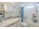 Bright bathroom with decorative mirror, shower with curtain, and fish decor at 156 N Hawes Rd # 68, Mesa, AZ 85207