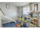 Bright bedroom featuring a custom-built bunk bed and plenty of toy storage at 156 N Hawes Rd # 68, Mesa, AZ 85207