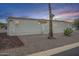 Well-maintained manufactured home with desert landscaping at dusk at 156 N Hawes Rd # 68, Mesa, AZ 85207