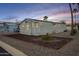 Charming mobile home with well-maintained landscaping and modern exterior at 156 N Hawes Rd # 68, Mesa, AZ 85207