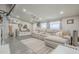 Inviting living room with a plush gray sofa, modern decor, and ample natural light at 156 N Hawes Rd # 68, Mesa, AZ 85207