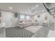 Bright living room featuring a comfortable gray sofa, ceiling fan, and modern decor at 156 N Hawes Rd # 68, Mesa, AZ 85207