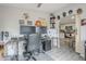 Bright office connected to the kitchen, featuring a gaming setup and unique decor for added character and convenience at 156 N Hawes Rd # 68, Mesa, AZ 85207