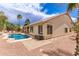 Inviting backyard oasis with a pool, patio, and palm trees for relaxing outdoors at 16023 S 30Th Pl, Phoenix, AZ 85048